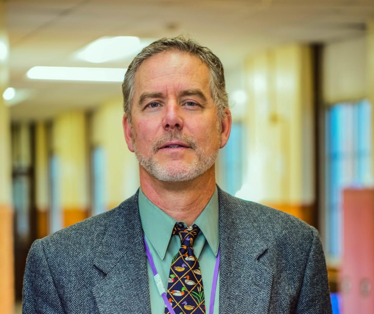 Mr. Herrle in the halls of Sewanhaka